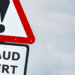 Street sign-type signs reading "Fraud Alert"